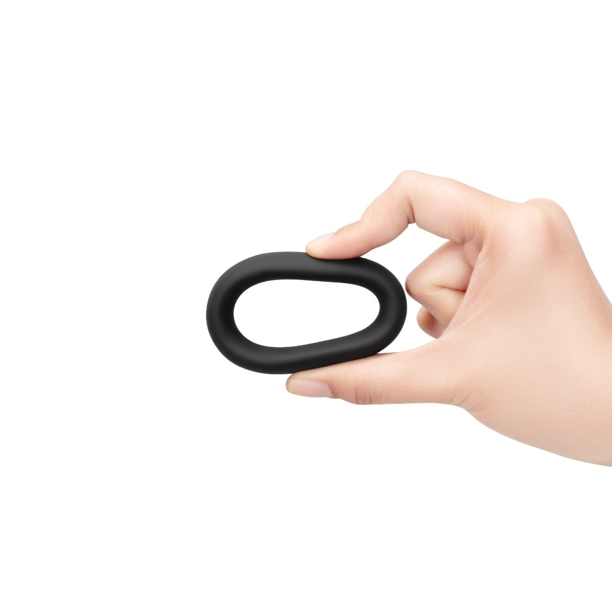 Fingers squeezing a b-Vibe SNUG RING - 40 MM SNUG FIT SILICONE COCK RING - BLACK