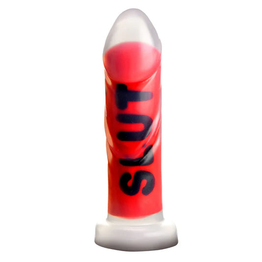 Master Series SLUT Silicone Dildo upright showing the word SLUT written over its ribbed length