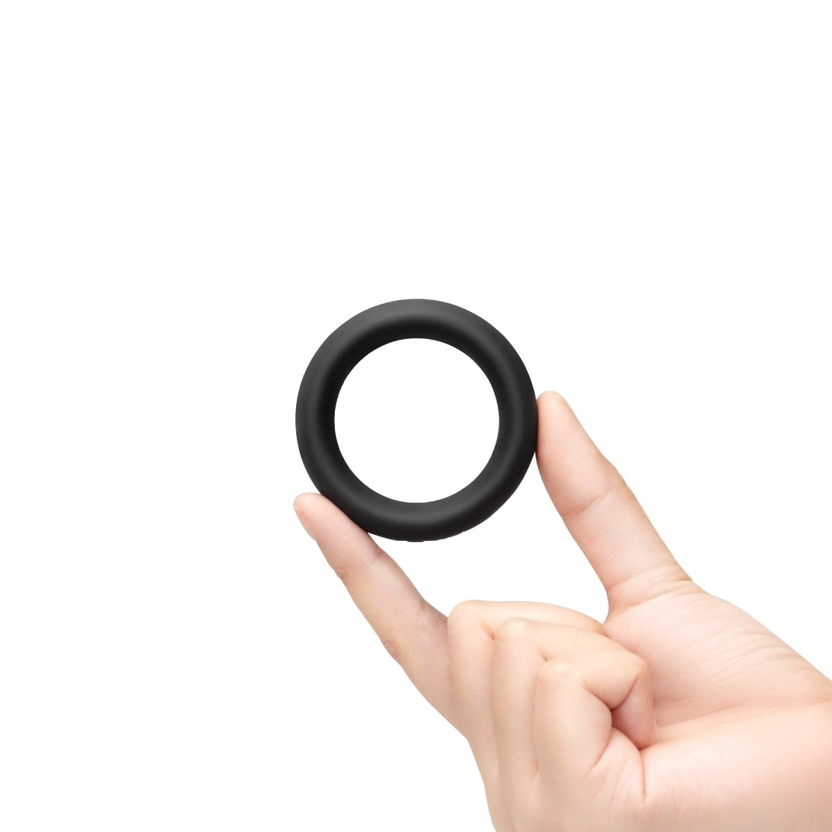 Hand holding a b-Vibe SNUG RING - 40 MM SNUG FIT SILICONE COCK RING - BLACK