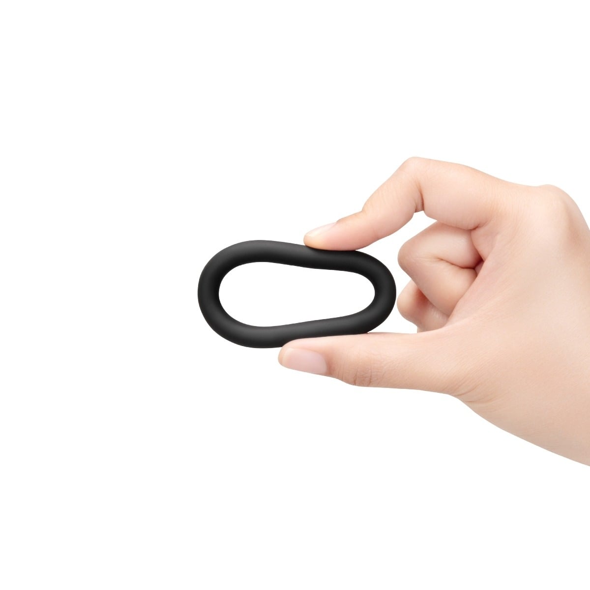 Fingers squeezing a b-Vibe SNUG RING LITE - 3-PACK SNUG FIT SILICONE COCK RING