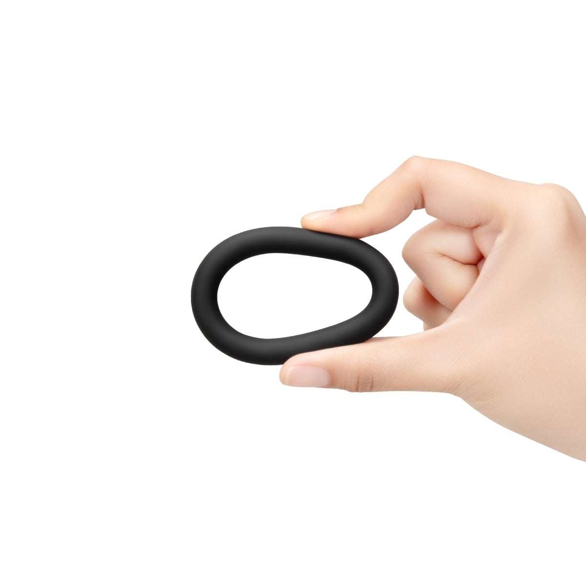 Fingers squeezing a b-Vibe SNUG RING SWOLE - 3-PACK SNUG FIT THICK SILICONE COCK RING