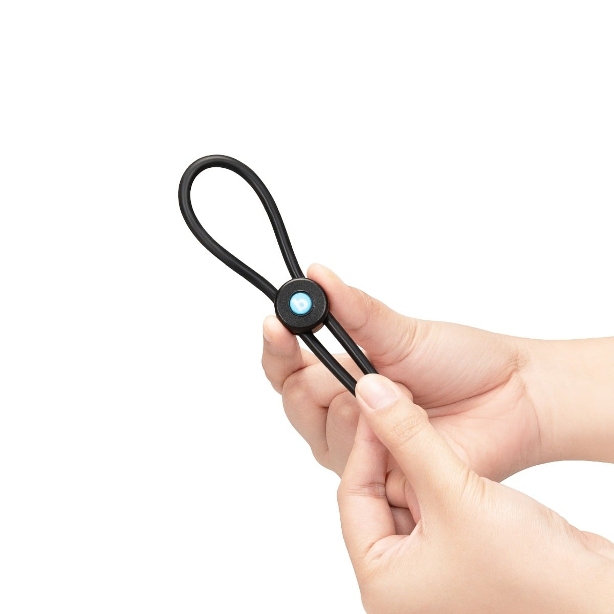 Hands holding a b-Vibe LASSO GRIP - FULLY ADJUSTABLE SILICONE COCK RING