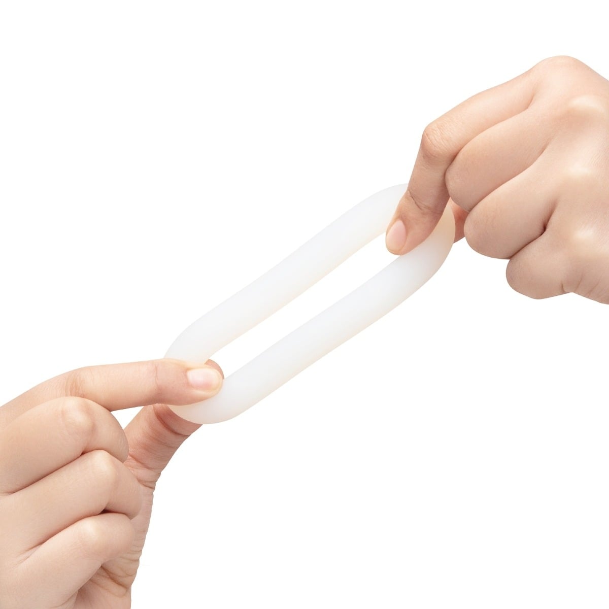 Hands pulling b-Vibe FLEX RING LOOP - SILICONE COCK RING - CLEAR to show elasticity