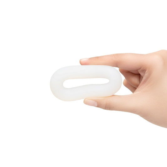 Fingers squeezing b-Vibe FLEX RING LOOP - SILICONE COCK RING - CLEAR