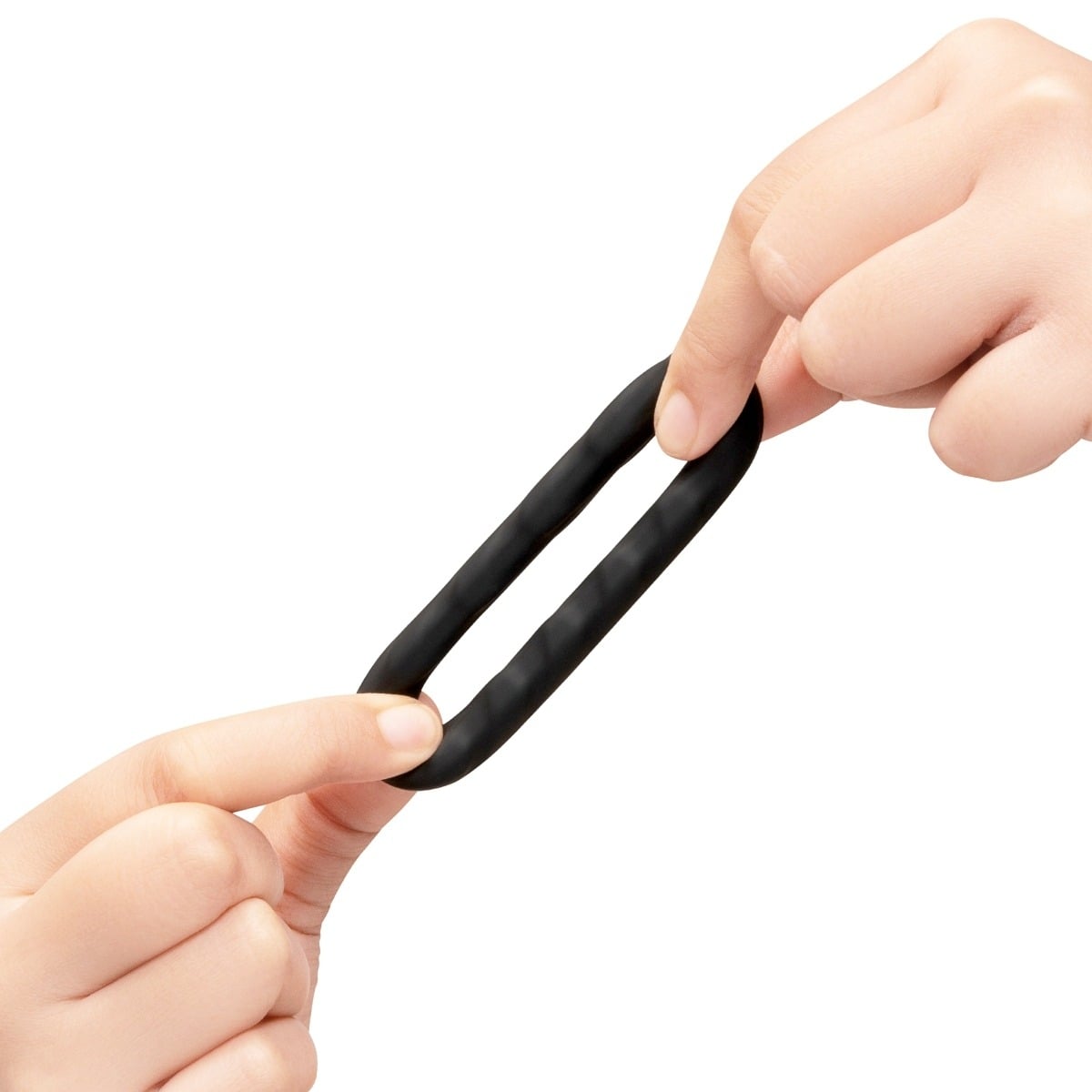 Hands stretching a b-Vibe FLEX RING TREAD - SILICONE COCK RING