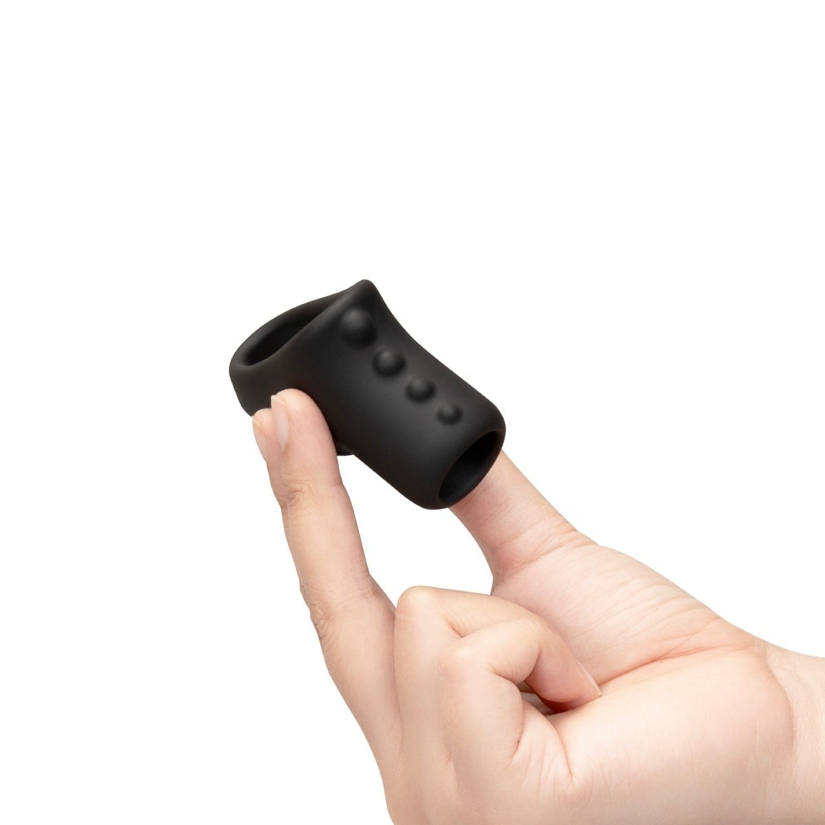 Hand holding b-Vibe FLEX RING SHAFT - SILICONE COCK RING & BALL STRETCHER