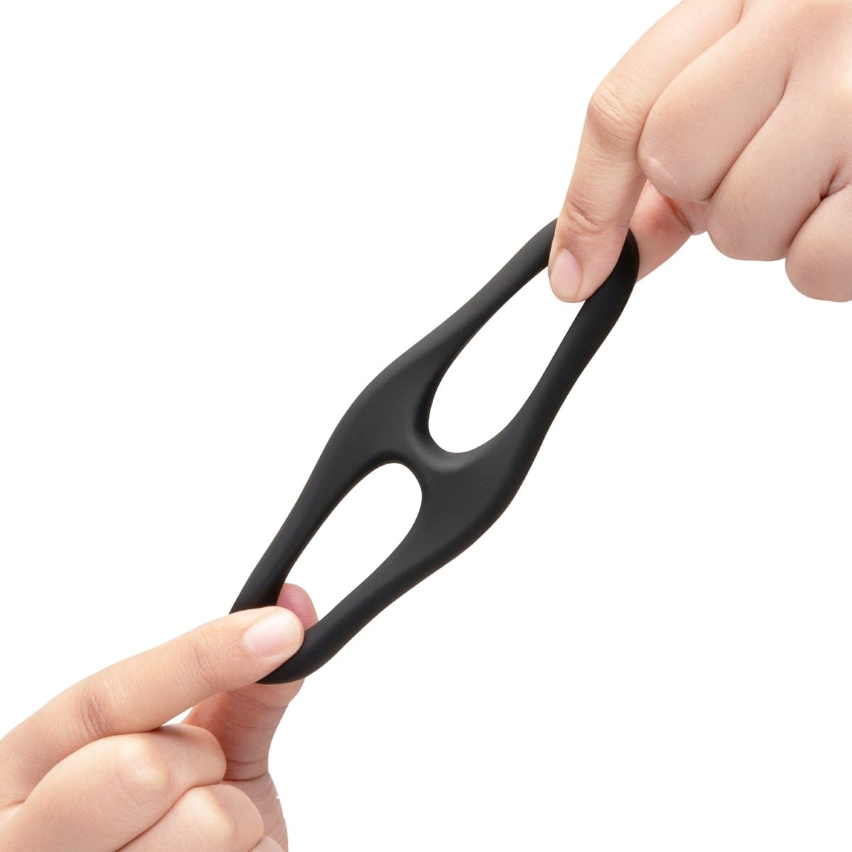 Hands stretching a b-Vibe FLEX RING EIGHT - SILICONE COCK RING