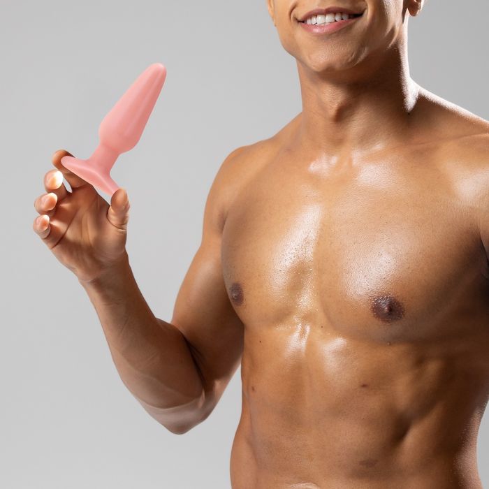 Model holding a Me You Us Butt Plug White 