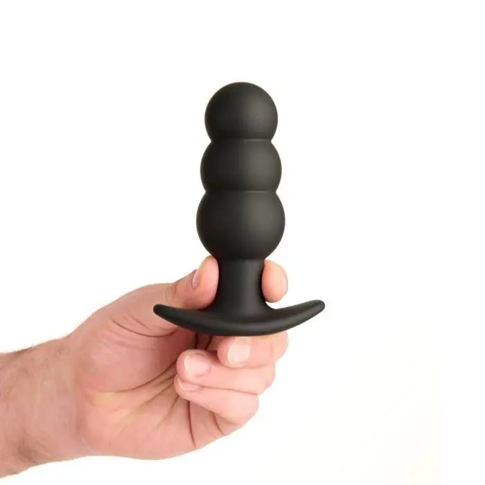 Prowler RED Bubble Rechargeable Plug with Remote held by model