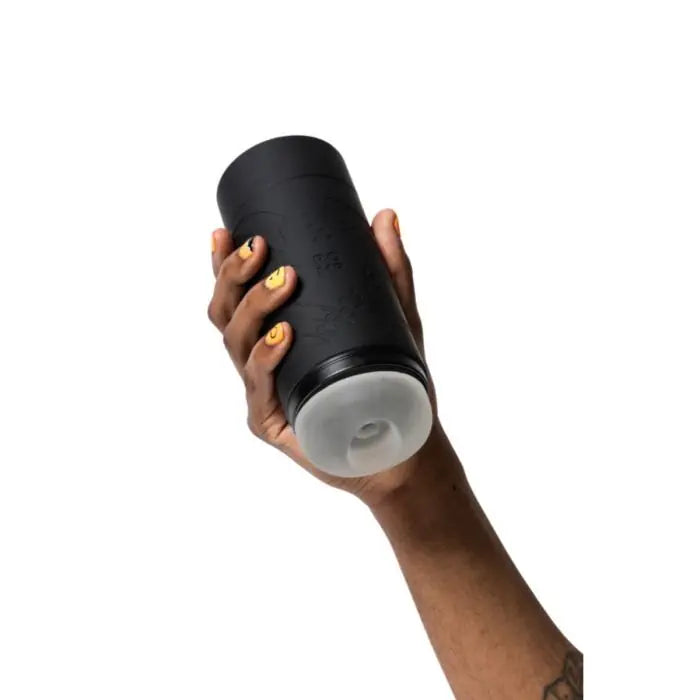 ROMP Dash Stroker held by model showing realistic opening