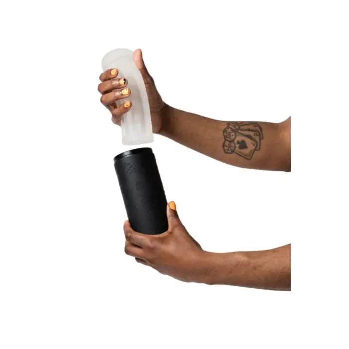 ROMP Dash Stroker held by model showing removable sleeve